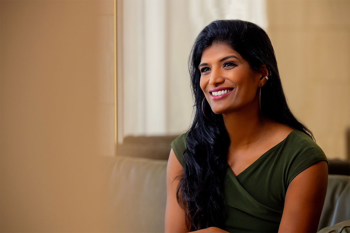 Smiling woman receiving preconception counseling in Palo Alto.